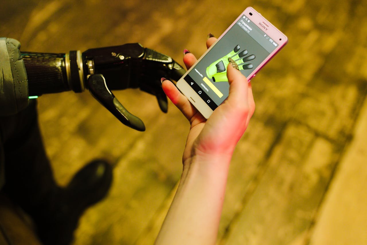 Services A close-up of a prosthetic hand interacting with a smartphone showcasing futuristic technology.